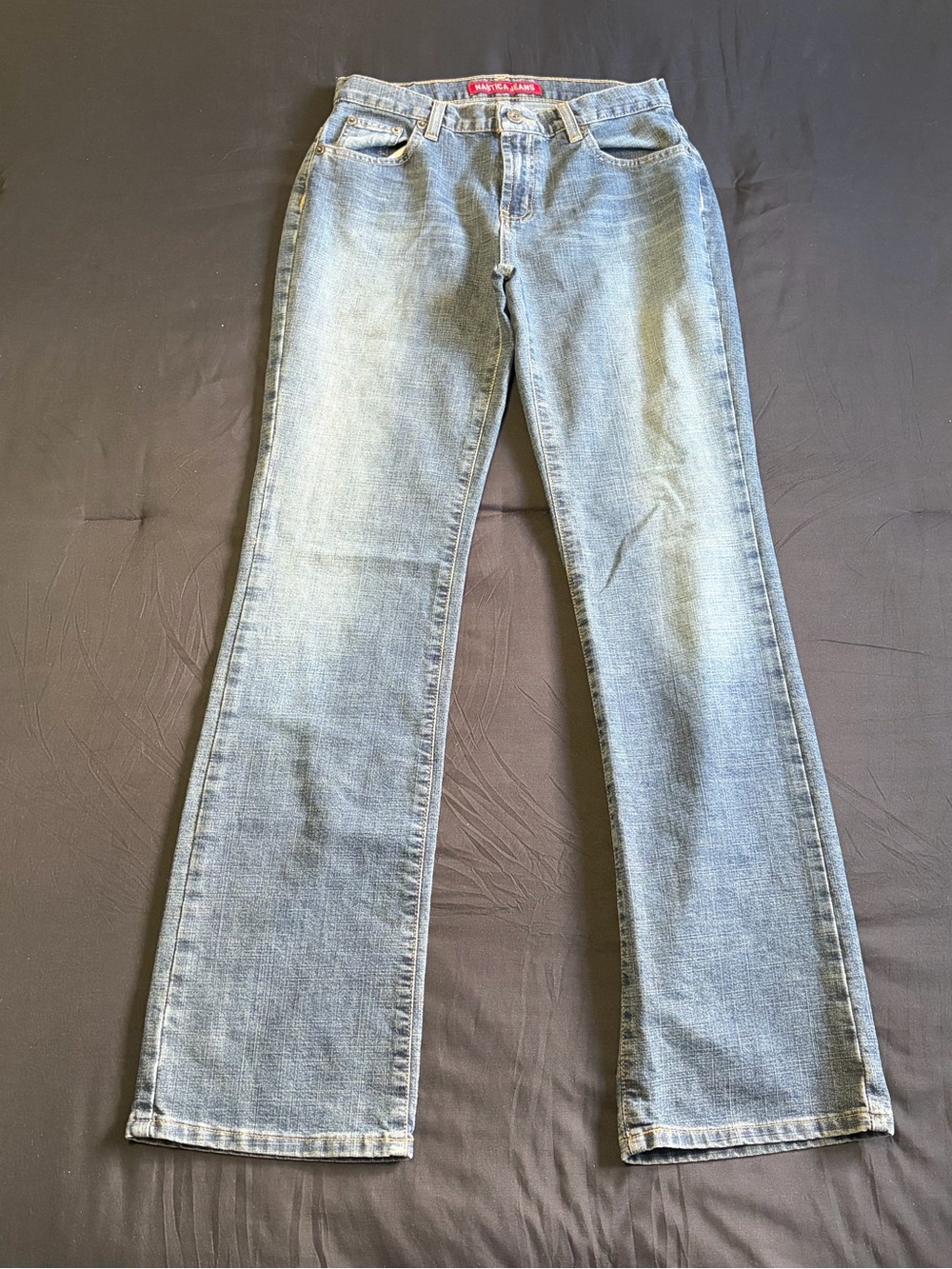 Vintage 2000s Nautica grey/ blue flare jeans with a cool yellow fade. Size 4